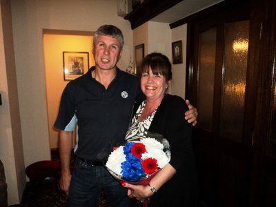 Geoff presenting Shirley with some flowers