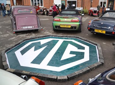 A BIG MG in the Paddock witht her Anniversary cars